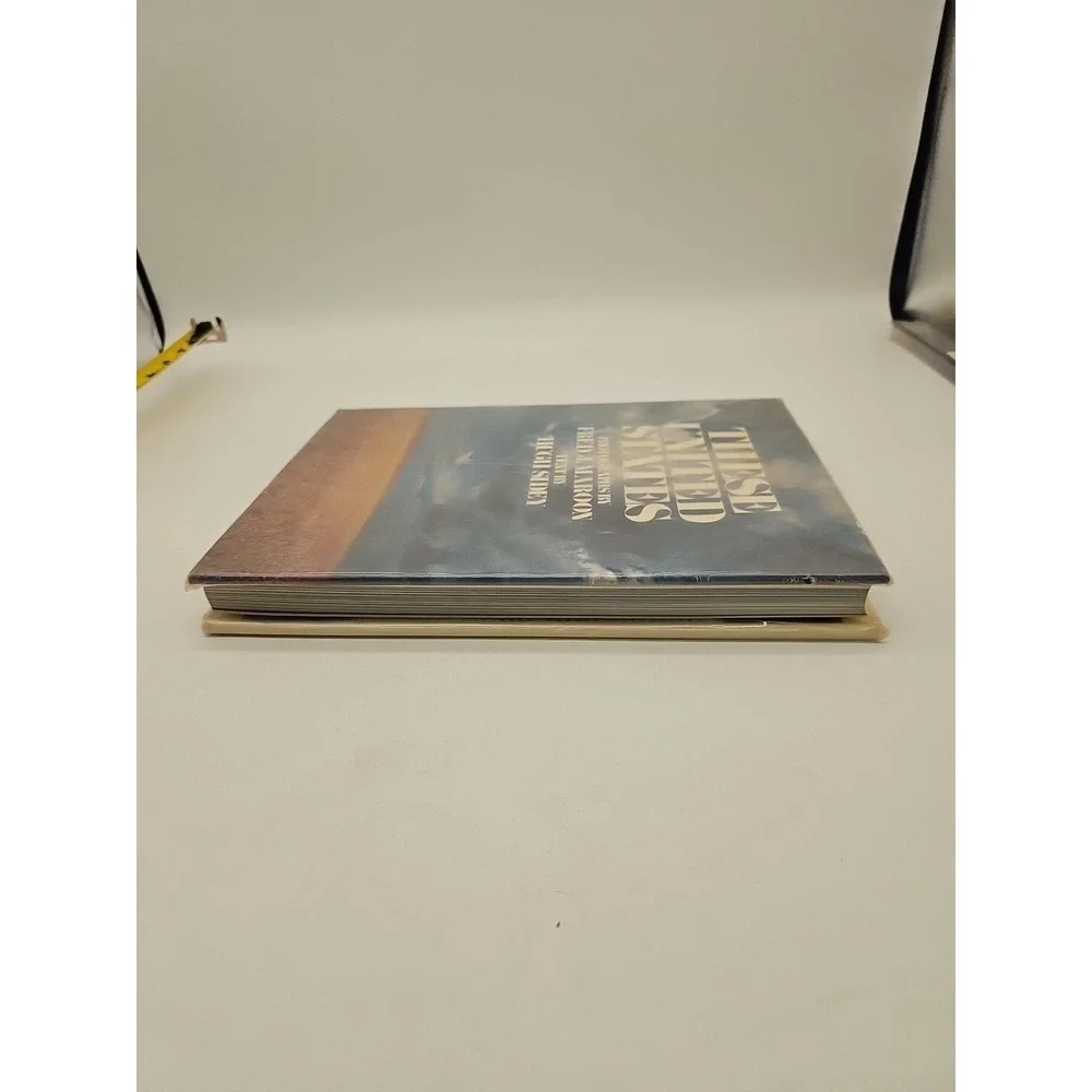 MAROON, FRED J. These United States / photographs by Fred J. Maroon ; text by Hu